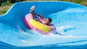 Children in a curve on a water slide
